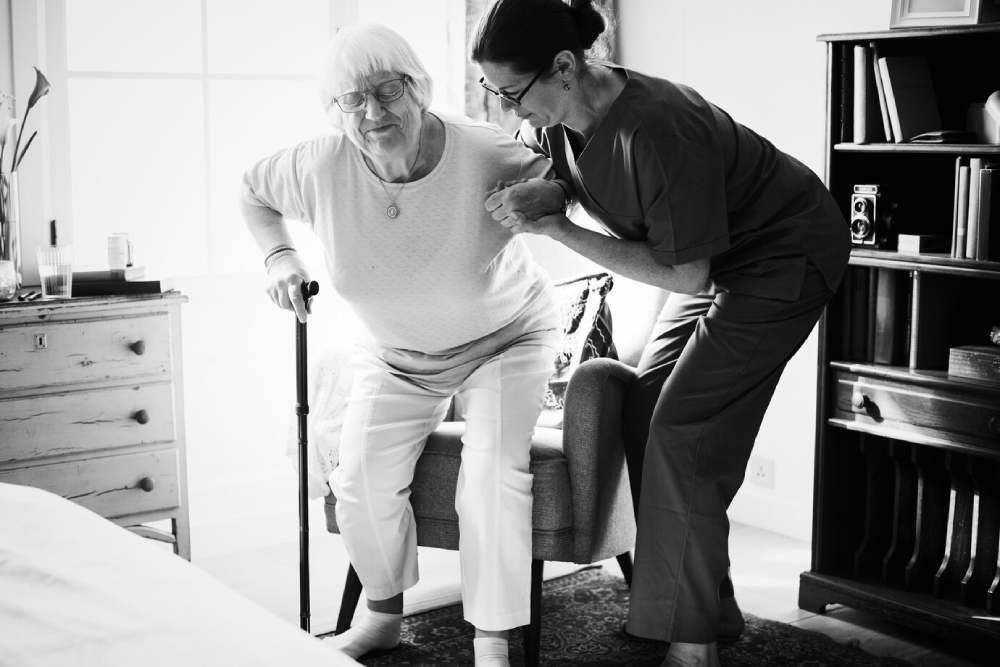 trained caregiver helping an elderly - short term respite care